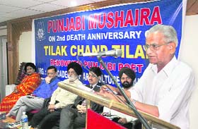 A poet makes his presentation during a Punjabi mushaira on the 2nd death anniversary of Tilak Chand Tilak at Jammu