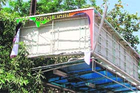Banners carrying pictures of SAD and BJP leaders, atop bus shelters in Ludhiana, have been removed by the election department