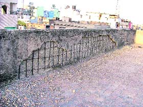Plaster of a building housing the municipal corporation’s four departments has peeled off giving a shabby look