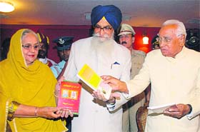 Haryana Governor Dr AR Kidwai (right) releases a book ‘Meri Do aur Betian’, authored by Surjit Singh Barnala, at Raj Bhavan in Chandigarh
