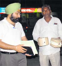 Officials from the prevention of food adulteration department after lifting samples from More Departmental Store, Sec 32, Chandigarh