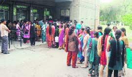 Students throng Jammu University for admission forms on Monday.