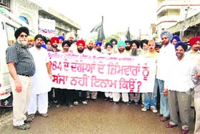 Riot victims take out a protest march in Doraha