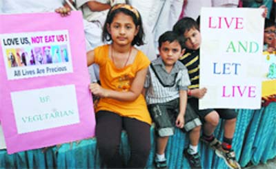Children promote vegetarianism during a function organised by the Akhil Bhartiya Ahinsa Sangh on the occasion of 