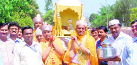 Devotees take out a procession on Mahavir Jayanti in Haridwar on Tuesday.