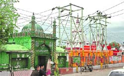 A mosque and a temple located on the banks of the Tawi in Jammu, which share a wall.