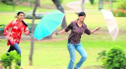 Girls just wanna have fun!: Students enjoy the rain in the green belt of Sector 11, Chandigarh