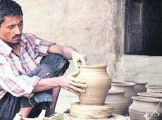 A potter makes earthen pots at Bullara village on the outskirts of Ludhiana.