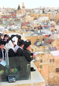 Dawn begins over the Western Wall and the Dome of the Rock in the Old City of Jerusalem
