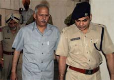 DGP K.K. Attri and SSP Ashish Chaudhary coming out of a meeting hall at the Mini-Secretariat in Bathinda on Thursday.