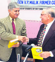 Former Chief of the Army Staff Gen VP Malik (centre) along with author Major-General Rajender Nath (right) releases “Flashpoints in South Asia” in Chandigarh on Thursday.