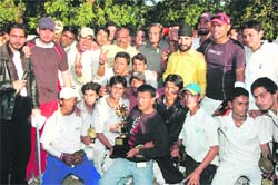 The victorious Uttarakhand team poses with the chief guest, Vijay Bahuguna, Congress leader,at Matawalabag, Dehradun, on Thursday. The team is seen with the T20 Gold Cup.