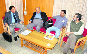 Members of the Raghavan committee talking to mediapersons at medical college in Tanda near Kangra on Thursday.