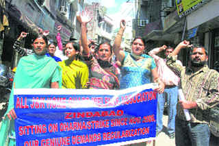 Members of the J&K Home Guards Association hold a protest in Jammu