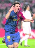 Barcelona's Lionel Messi celebrates after scoring against Bayern Munich during their Champions League quarter-final, first-leg soccer match at the Nou Camp stadium 