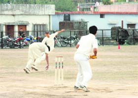Fielders try to stop the balls at the Khalanga Cricket Tournament in Dehradun