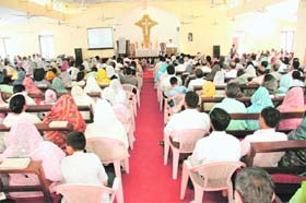 A prayer meeting being held at a church in Dehradun
