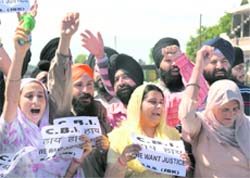Sikhs hold a protest against Congress leader Jagdish Tytler in Jammu on Friday.