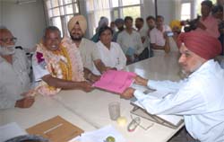 Hardev Arshi, the CPI candidate for the Bathinda Lok Sabha seat, files his nomination papers before Upjeet Singh Brar, the assistant returning officer, in Bathinda on Saturday.