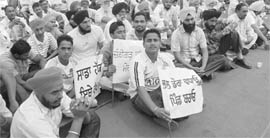 Members of the Pind Bachaoo Committee during a public meeting at Attawa village on Saturday.