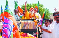 BJPs North East candidate B.L. Sharma Prem with his wife on the way to file his nomination papers for the forthcoming elections, in East Delhi 