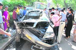 The mangled remains of a car involved in a road mishap in Gurgaon 