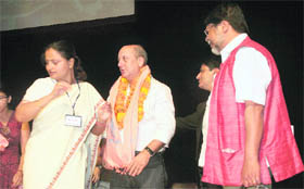 Bollywood actor Anupam Kher being felicitated during the Third World Kashmiri Pandit Conference at Jammu University on Saturday. 