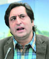 Sajjad Ghani Lone addresses mediapersons at his residence in Srinagar on Saturday.