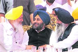 (From left) Jails Minister Hira Singh Gabria, Deputy Chief Minister Sukhbir Singh Badal and Amrik Singh Aliwal share a light moment during a rally in Mullanpur Dakha on Saturday.