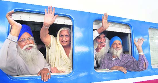 Sikh devotees leave for Baisakhi celebrations at Gurdwara Panja Sahib in Pakistan, at the Amritsar railway station on Saturday.