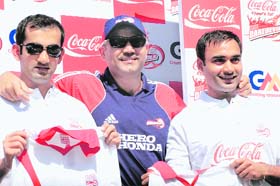 (L-R) Gautam Gambhir, Virender Sehwag and Amit Mishra share a light moment as they pose during a sponsored send-off event for the Indian Premier League (IPL) cricket tournament, to be held in South Africa, in New Delhi