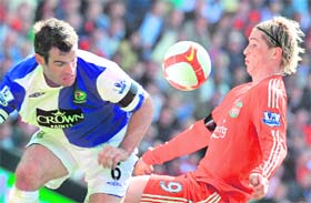 Liverpool's Fernando Torres (R) vies with Blackburn Rover's Ryan Nelsen during the Premiership match