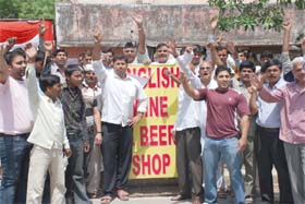 Residents of Sector-4 in Gurgaon demonstrate against the opening of wine shops in residential areas