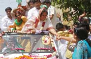 BJPs Sudha Yadav goes in a flower-bedecked vehicle to the returning officers office in Gurgaon