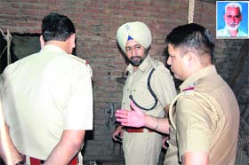 DSP Bhupinder Singh inspects the room where the 55-year-old man (inset) committed suicide
