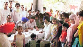 A view of people at the camp organised to detect hepatitis-C virus at Jandali Kalan village near Ahmedgarh