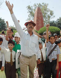 Jagdish Bhagat Singh shouts patriotic slogans along with children at the bagh.