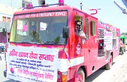 Fire officer BK Agri leads the fire vehicles carrying the safety message in Haridwar on Tuesday