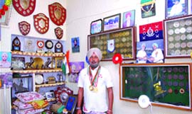SI Jagdish Singh, a horse rider from the 7th Battalion of the Punjab Armed Forces Headquarters, shows his medals in Jalandhar