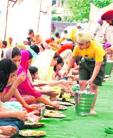 Langar being served on Baisakhi at Gurudwara Singh Sabha, Urban Estate, Ludhiana.
