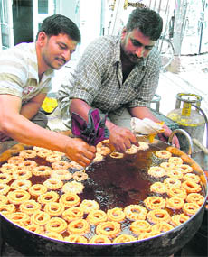 Shopkeepers prepare sweets on the occasion of Baisakhi in Ludhiana on Tuesday.