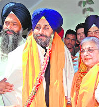SAD president Sukhbir Badal with Amarjit Kaur and party candidate from Patiala Prem Singh Chandumajra in Patiala on Tuesday. 