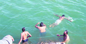 Police officials and divers look for bodies of the four children who drowned in the Sutlej  near the Tibbi Sahib Gurdwara, near Ropar, on Tuesday.