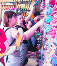French artistes in a shop selling Punjabi jutti in Amritsar on Tuesday. 