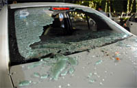The window panes of a car smashed by the mob at Queensland Marriage Palace in on Wednesday.