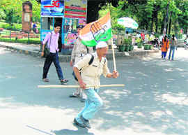 Avval Singh Negi, a Congress worker from Pana Erani area of Chamoli district, canvassing support for the party in Dehradun on Wednesday.