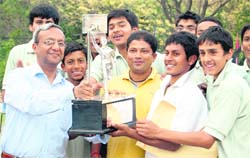 Welham Boys receive Afzal Khan Memorial Basketball Tournament trophy from Alok Jain, Finance Secretary, in Dehradun 
