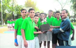 Chandergupt section players with their Inter-Section Basketball trophy in Dehradun