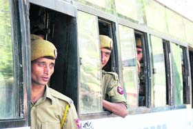 Security personnel board buses for various polling stations of the Jammu LS constituency in Jammu