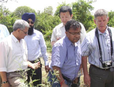 Kazuya Kolzumi and Tony Zatylny, experts from Japan and Canada, visiting fields in Abohar.
